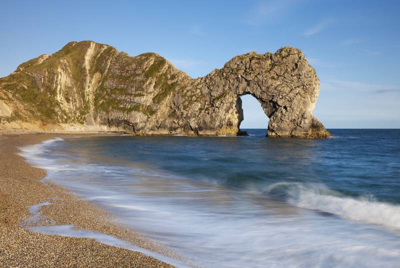 Durdle Door is an eroded rock arch off the Jurassic Coast national park and coastal path in Dorset, and a national landmark