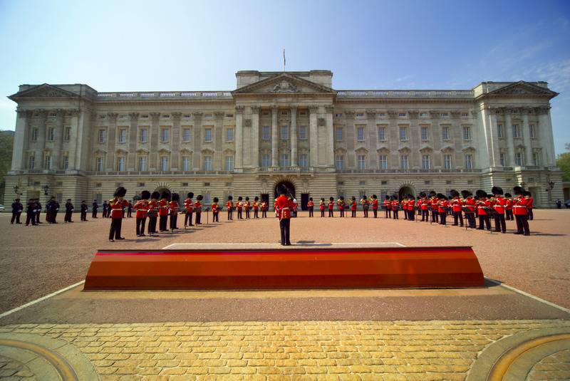 Band performing during The Changing of the Guard ceremony taking place in the courtyard of Buckingham Palace, Westminster, London